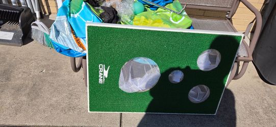 2 golf game boards with soft golf balls