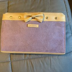 Modella brand clutch-style cosmetics or makeup bag