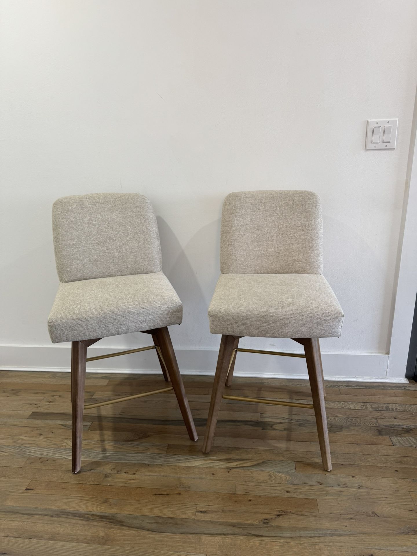 Pair of Beige Upholstered Mid-Century Modern Barstools with Wooden Legs