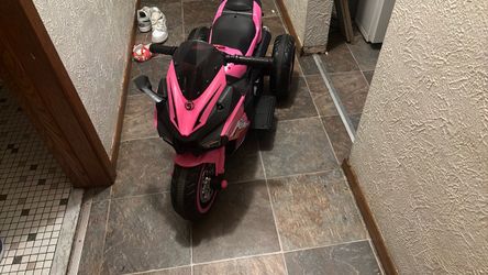 Pink and black 3 wheeler