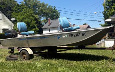 12 Foot Bass Boat. 6 HP Outboard.