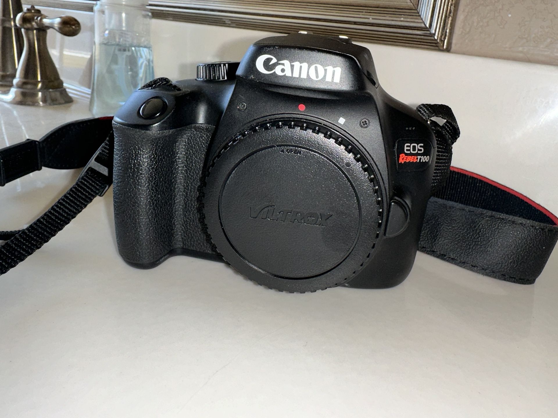 Canon T100