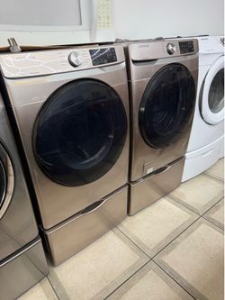 Samsung front load washer and electric dryer set