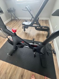 Peloton Bike with Mat + Custom Peloton Wall Decor – Excellent Condition – $700 OBO
