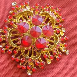 red crystals brooch 
