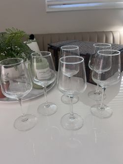 Twelve Stemmed Wine Glasses And Wicker Case