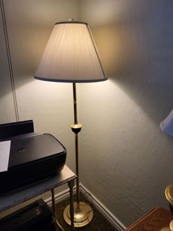 Floor lamp brass, 2 table lamps, brass. They're all three ones set new shades on them, perfect