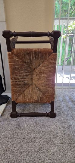 vintage Tell City maple wood stool with a woven rush seat and turned legs.
