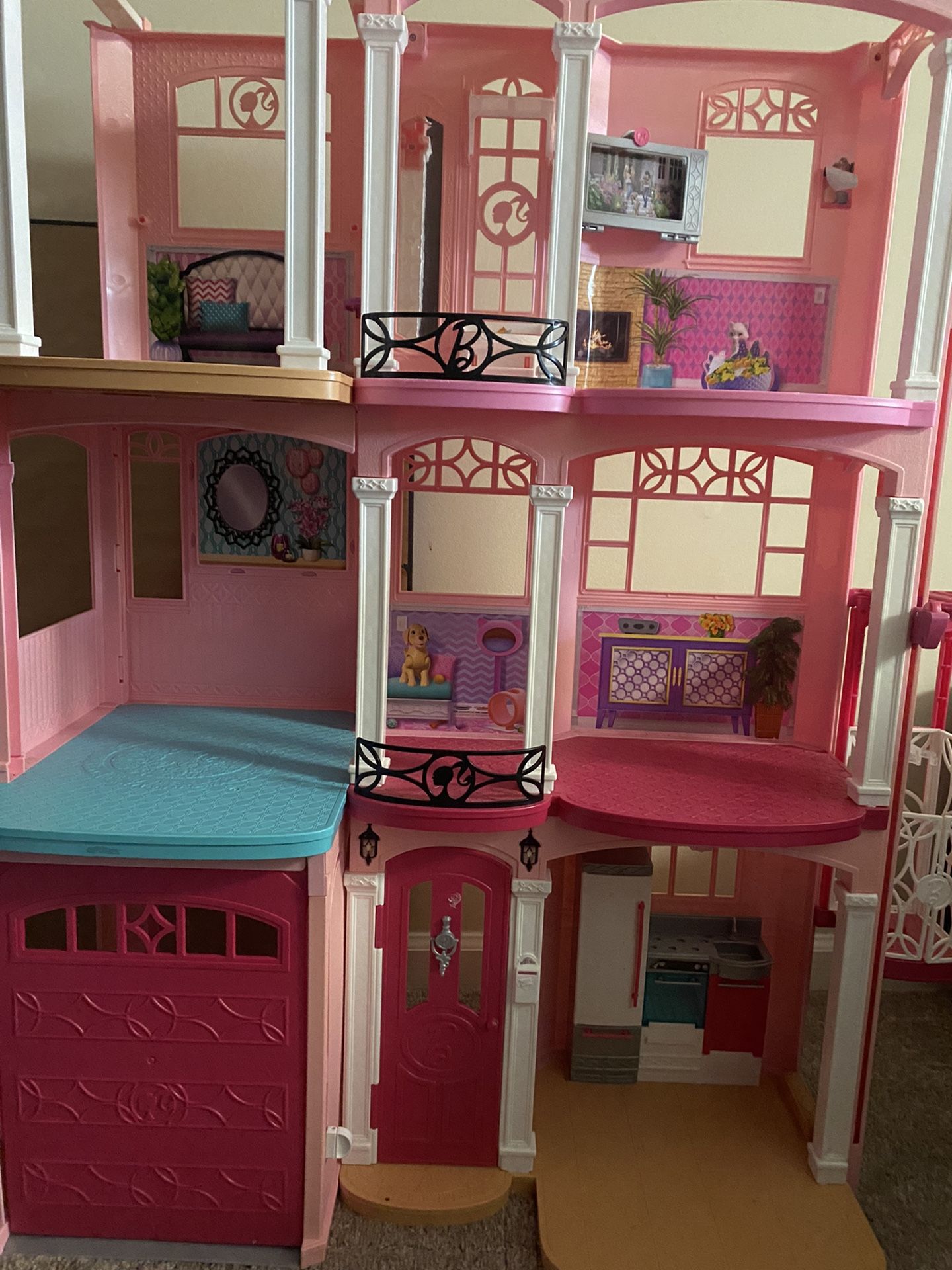 Barbie dream house with accessories,  vehicles, clothes, etc.