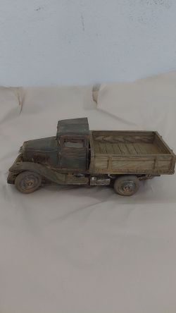 vintage-style collectible figurine of a 1930s farm cargo truck