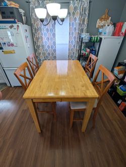 Solid wood pub table with butterfly leaf and 4 chairs