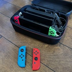 Nintendo Switch V2 + Joycons + 10 Games + Travel Case