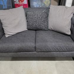 Tufted two-person love seat