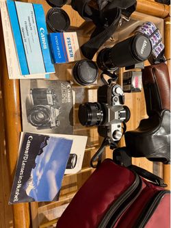 Vintage Canon AE-1 with case, macro zoom lense, other lense, carrying case, strap, film