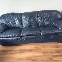 Comfortable leather couch in good condition.
