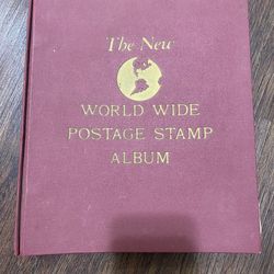 Vintage stamp album "The New World Stamp Album" published by Minkus Publications.
