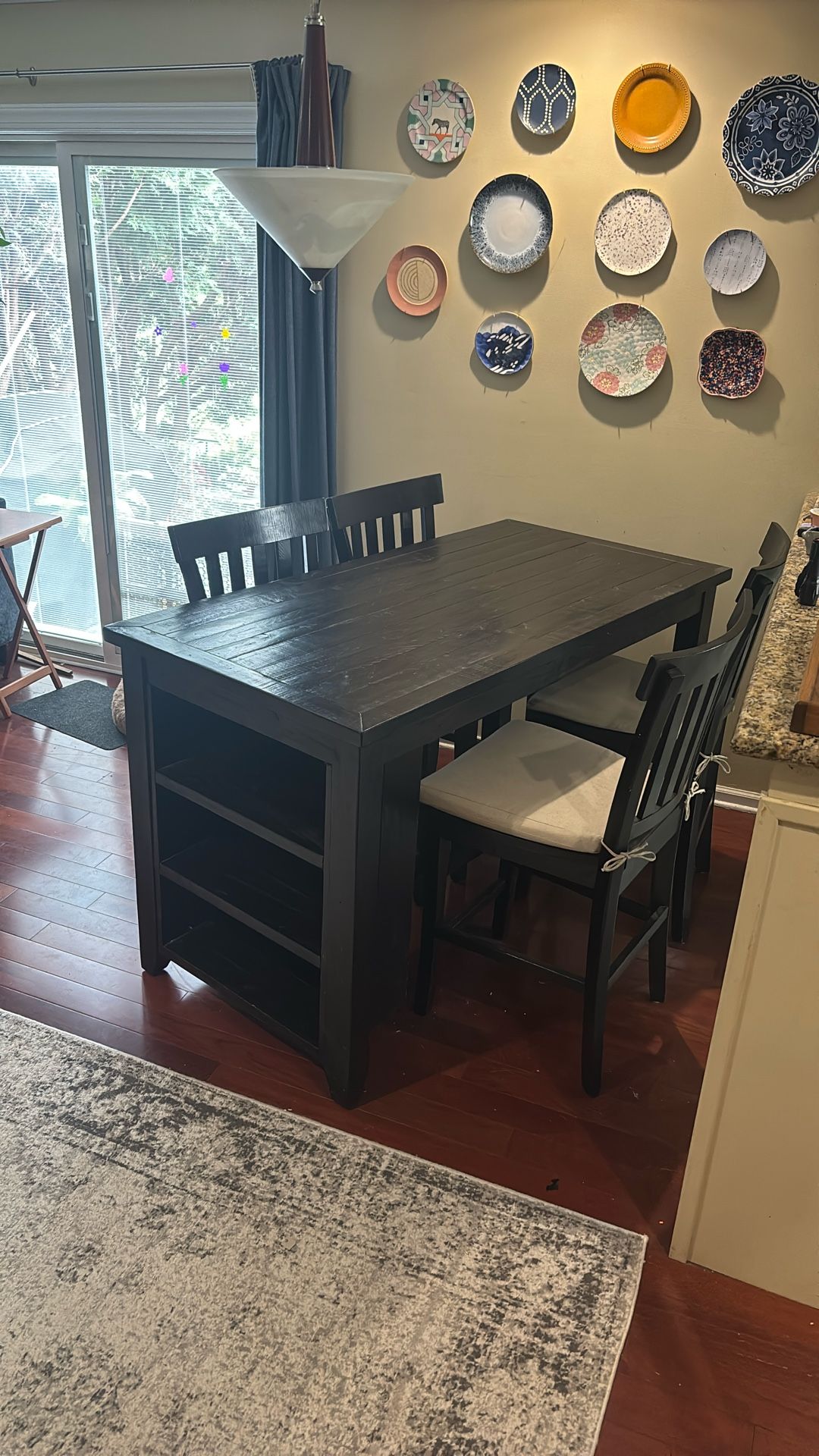 Tall Table With Four Chairs And Bookshelf