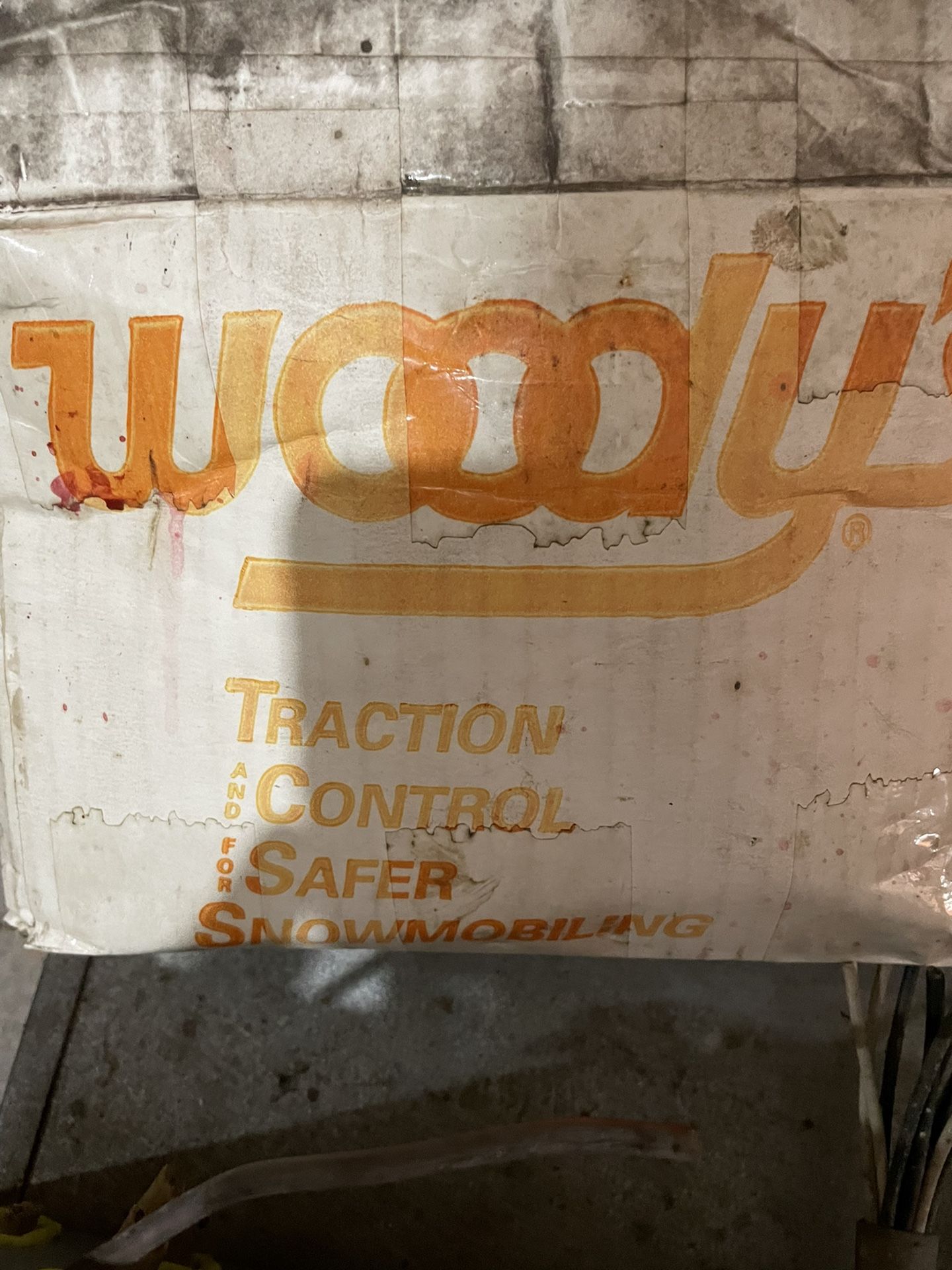 Snowmobile traction studs