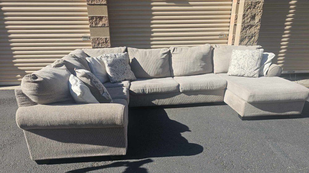 large beige sectional couch in good condition, no rips or holes on fabric, free delivery
