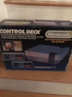 original nintendo console with 4 remotes 2 guns and games