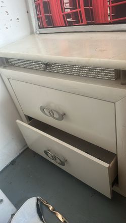 Bed frame mattress and a night stand and long dresser