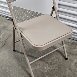 4 metal folding chairs with padded seats