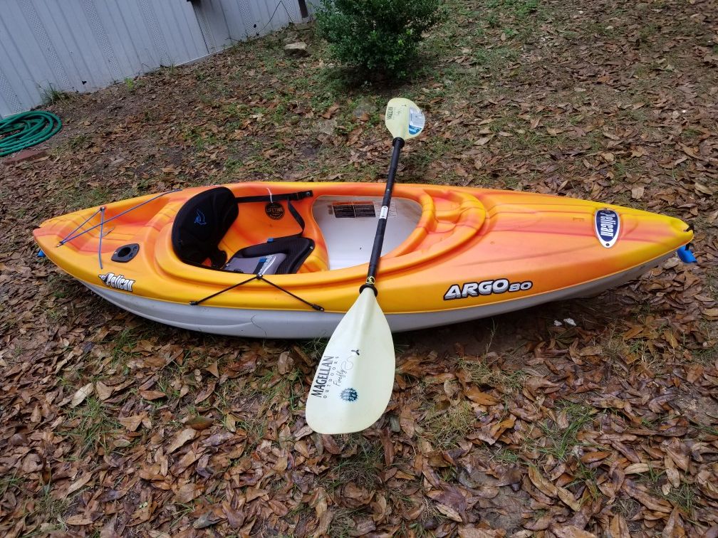 Pelican Argo 80 like new used once still has tag. Comes with paddle and Magellan kayak cart
