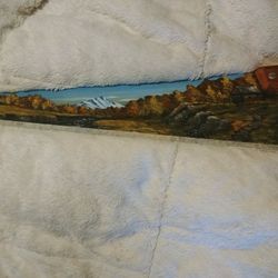 Saw With An Oil Paiting On It.