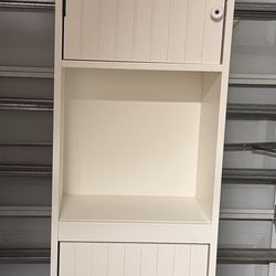 Storage cabinet with doors and shelves