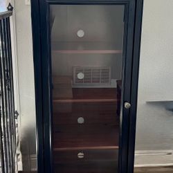 Bush Stanford Audio Cabinet with glass door in an antique black finish