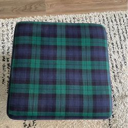 (2) green ottomans