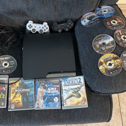 PS3 With Controllers And A lot Of Games