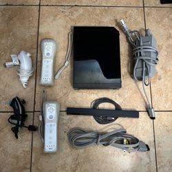 Nintendo Wii with cords, 2 controllers and 2 nunchuks