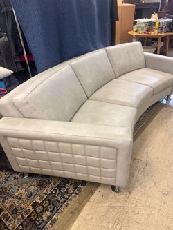 Highend Gray Leather contemporary curved leather sofa made by Design NS featuring distinctive square-stitched quilting on the track arms - 99” x 38” -