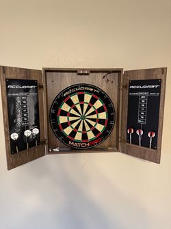 Dart board with wall mounted cabinet