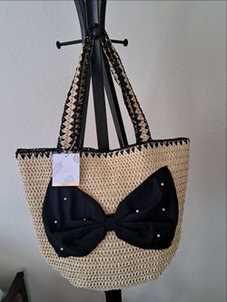 Cream straw tote with black bow