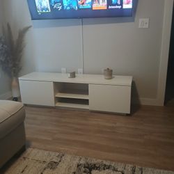 Oatmeal colored sofa black and white pictures black and white rug black and white floor lamp