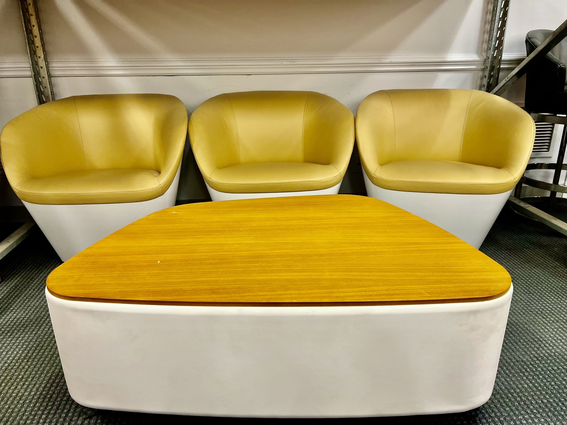 Set of mid-century modern lounge chairs and a coffee table.