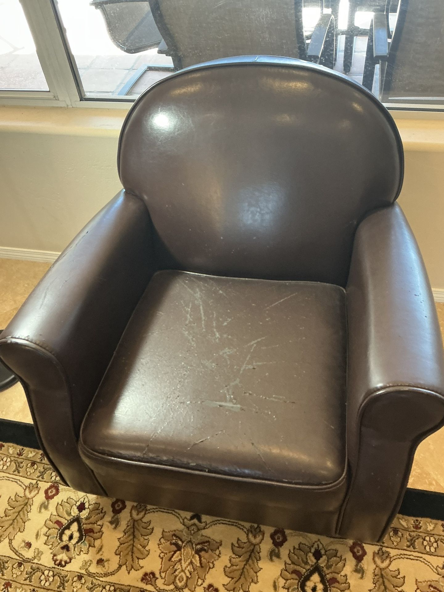 2 Brown faux leather armchairs