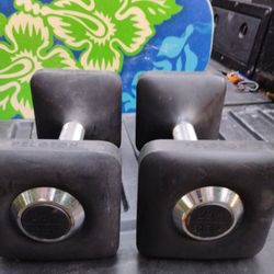 PAIR  OF  PELOTON  25 LB.  RUBBER  DUMBBELLS  USED