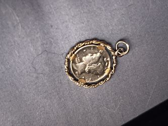 Us Mercury dime coin, silver pendant, and coin