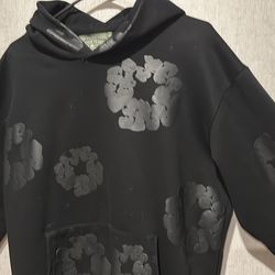 Black monochrome denim tear