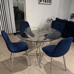 Glass dining Table With 4 Blue Chairs