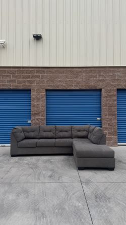 Ashley’s grey Sectional sofa couch