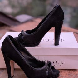 Black Suede White house black market Size 7 high heels with small bow.

Very well cared for, in excellent condition. 

There are some scuffs on the bo