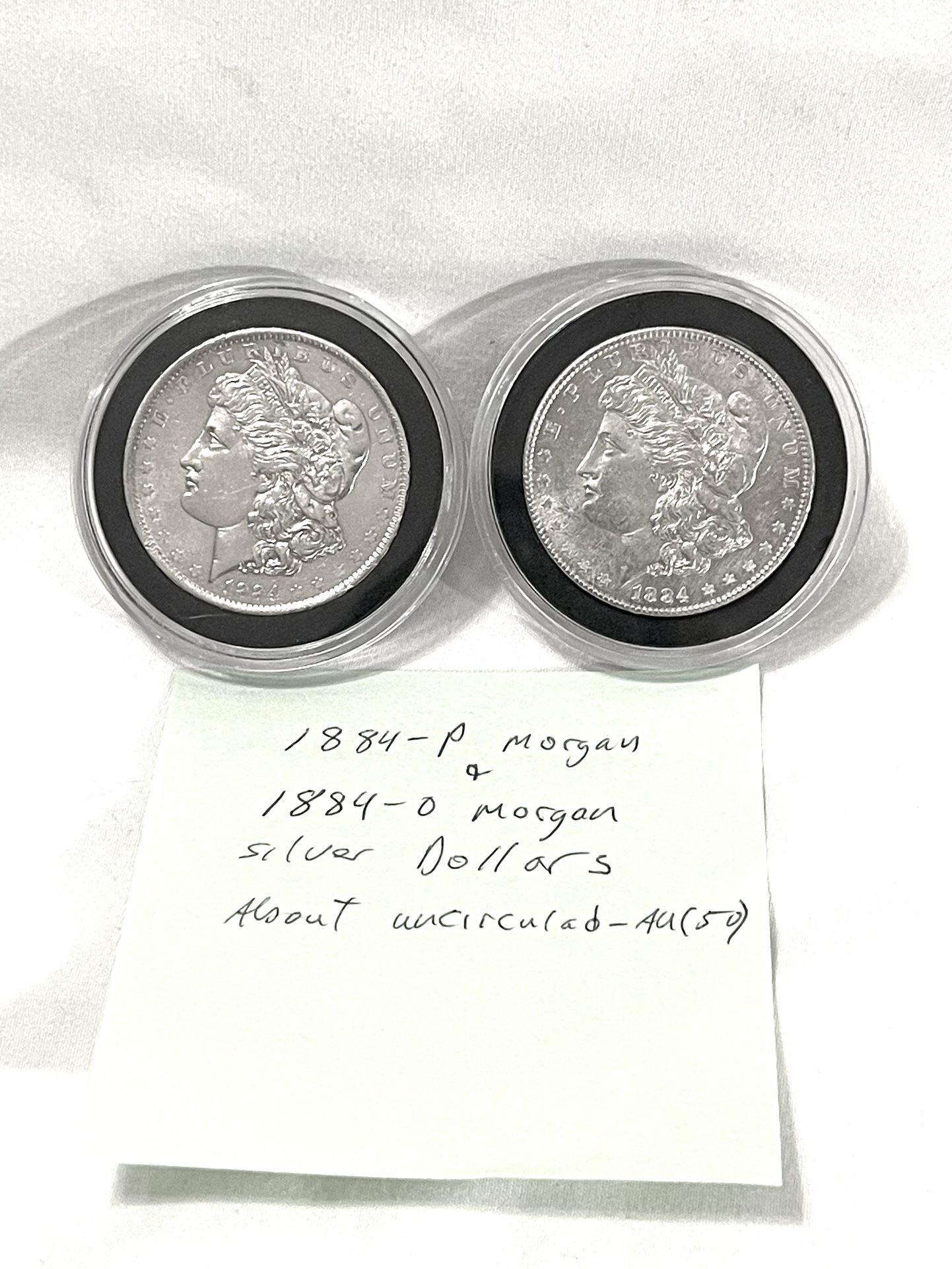 About Uncirculated-AU(50) 1884 And 1884-O Morgan Silver Dollars. Read Description.