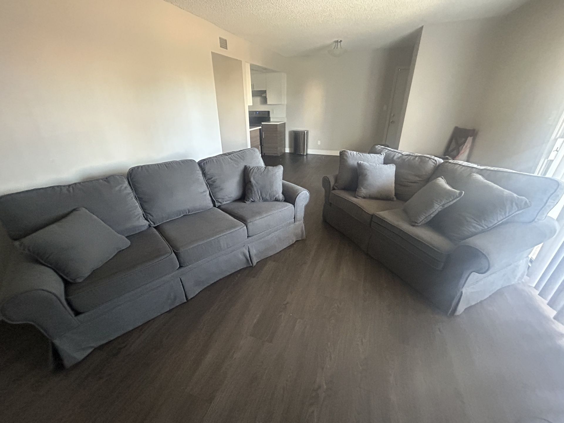 Two Couches With Matching Pillows