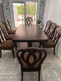 Ashley Dining dark cherry table with 8 chairs