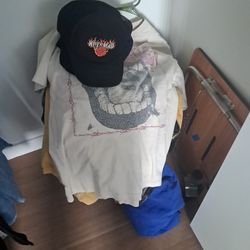 Assortment Of Hats Shirts And Jackets