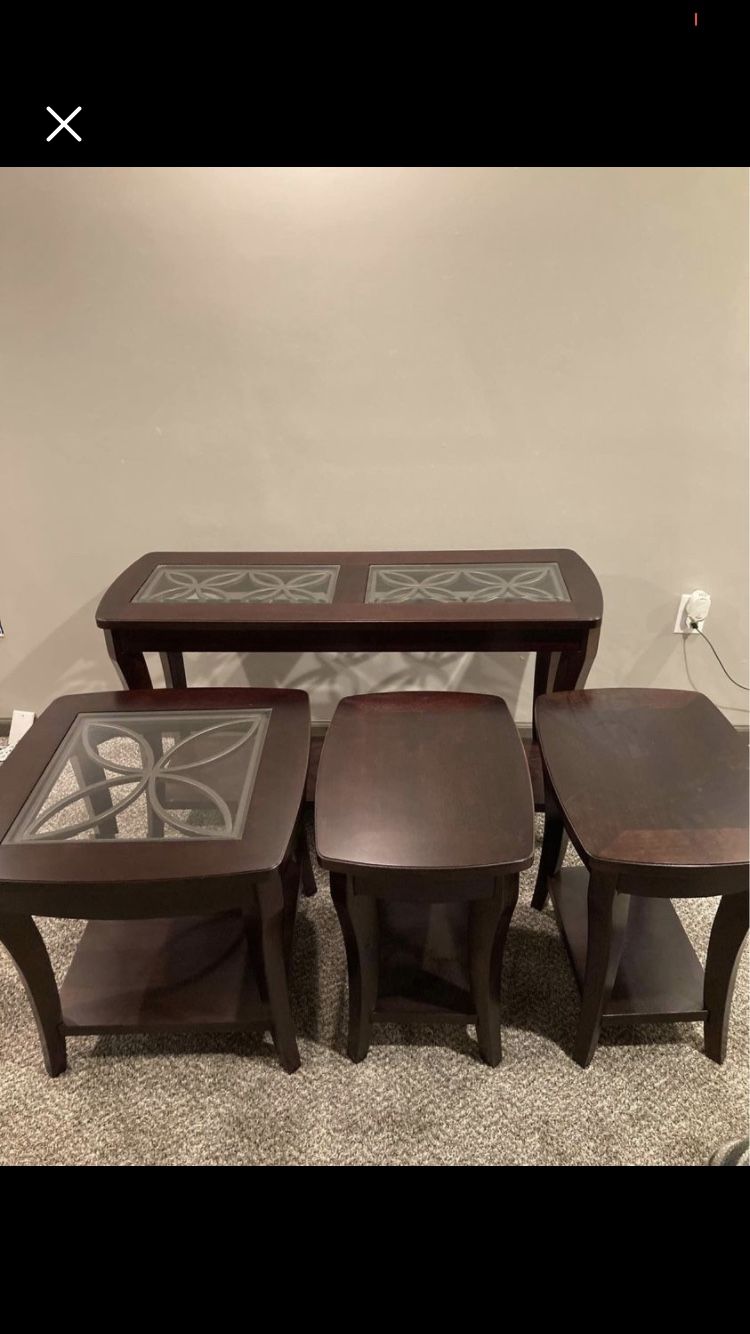 Couch/ hall table, glass end stand, and two solid end stands from Sheely’s